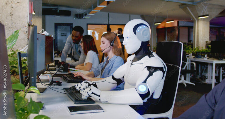 Robot working at computer among people. Maschine typing on keyboard in office. IT team of future. Futuristic worker. Humanoid work at call center. Support job. Selling concept. Technologies.